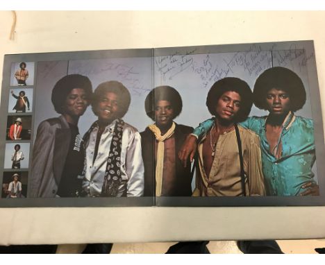 A Jacksons LP "Destiny" fully signed by Michael, Tito, Marlon, Jermaine & Jackie with dedications to Reg Moule, chauffeur. Mi