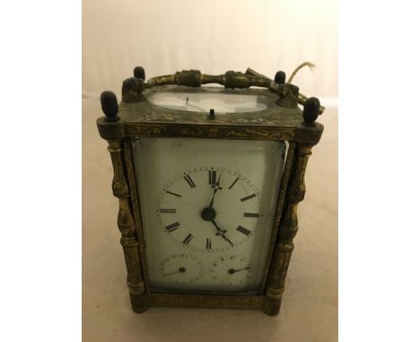An early 19th century brass repeater calendar dial carriage clock