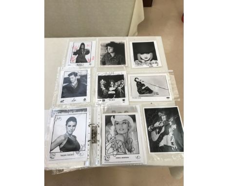 A folder of signed promotional photographs and pictures to inc Cyndi Lauper, Neil Diamond, Ian Gillan, Celine Dion, Da Brat, 