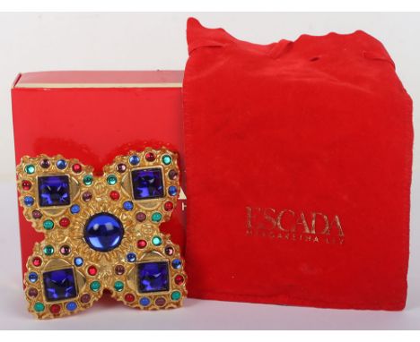 Escada Clover/Cross Brooch with Blue, Red, and Green Stones on a Gold Mount
Add a touch of luck and elegance to your outfit w