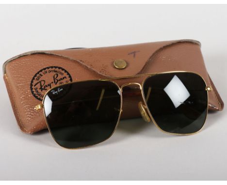 Vintage Rayban Aviator Sunglasses These are an absolute classic, styled in a gold frame with black lenses. A must-have for al
