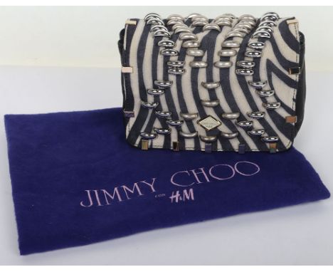 Jimmy Choo for H&M Minibag/Clutch Bag
Make a bold statement with this eye-catching Mini Jimmy Choo for H&M Clutch, featuring 