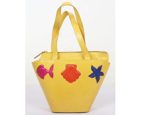 Escada Yellow Mini Bucket Bag.                                                        Embrace a playful coastal vibe with the