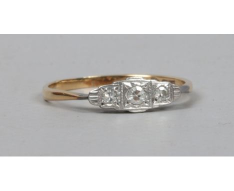 An Art Deco 9ct gold and platinum three stone diamond ring size P1/2