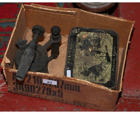 An early Veritas camping stove in original tin box along with brass blow lamp.