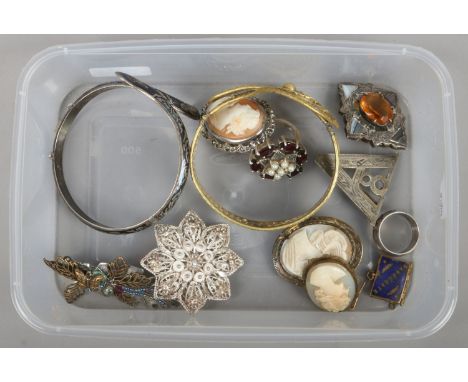 A box of vintage costume jewellery including filigree gilt bangle, cameo brooches and a Scottish agate and citrine brooch.