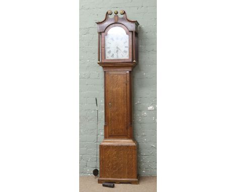 A Victorian oak longcase clock with swan neck pediments, painted dial and reeded columns (AF).