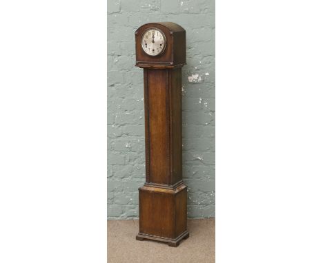 A mid C20th oak cased granddaughter clock (AF). 