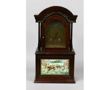 The Old Berkshire Hunt Foxhound clock. Wall mounting and striking on three gongs, decorated with a reverse print on glass dep