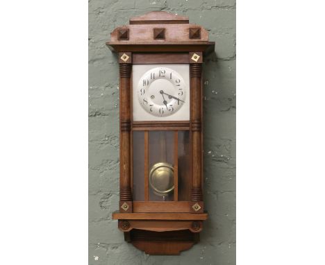 A 1908 Junghans eight day mahogany cased wall clock.