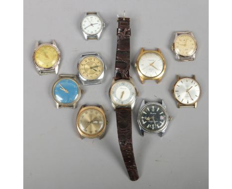 A quantity of wristwatch heads to include manual examples.