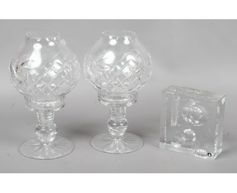 A vintage Swedish Pukeberg art glass stick holder, along with a pair of crystal cut glass candle holders with shades.