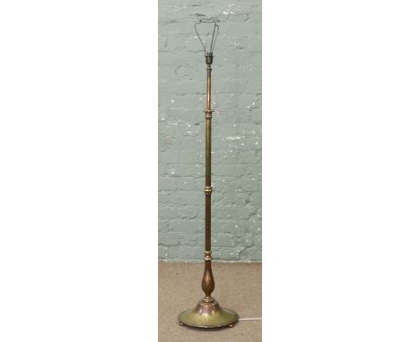 A brass and copper rise and fall standard lamp.