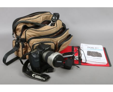 A Canon EOS 1OD digital SLR camera with power grip Cosina 28-210mm lense charger and instruction manual in carry bag.