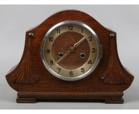 A mid C20th oak cased mantle clock with twin train movement