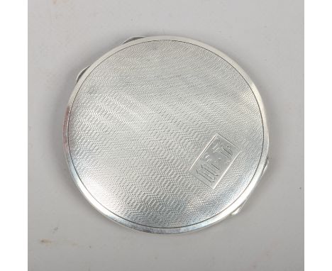 A George V silver powder compact with engine turned engraving and monogrammed L.M assated Birmingham 1931.