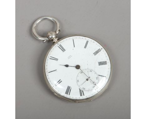 A continental silver cased slim pocket watch with enamel dial and subsidiary seconds.