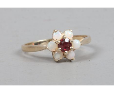 A 9ct gold opal and garnet cluster ring, size P.