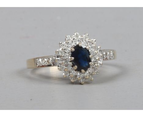 A 9ct gold sapphire and diamond cluster ring, size P.