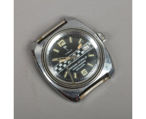 A 1970s gentlemans Timex Emerson Fittipaldi manual watch head with centre seconds and date display.