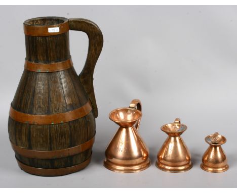 A Copper made bound pot belly jug, stamped Radford c1800 along with a set of three graduated copper measures.
