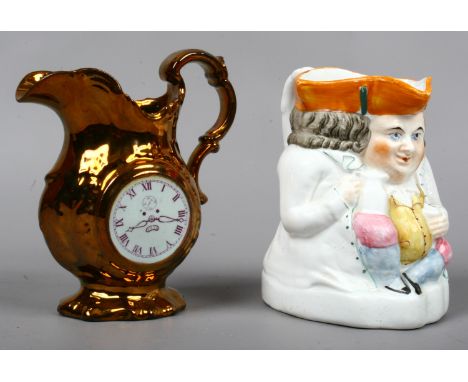 A Staffordshire pottery Toby jug and a copper lustre jug decorated with a chinoiserie figure on one side and a clock face on 