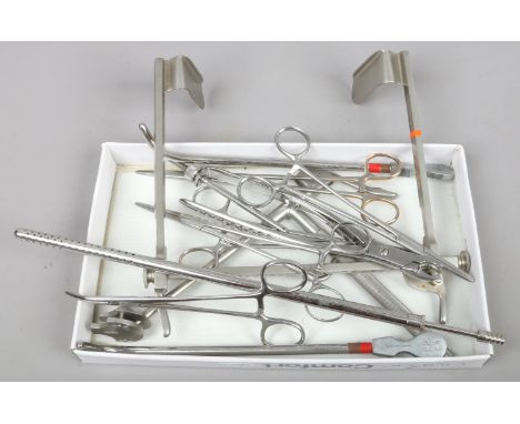 A box of assorted surgical tools.