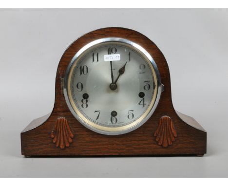 An oak cased Enfield Westminster chime mantle clock complete with pendulum and key.