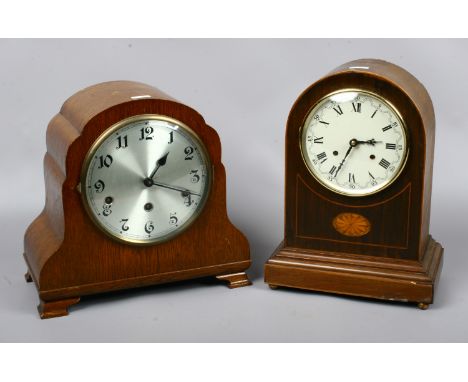 A mahogany cased dome top mantel clock and an oak cased Westminster clock.