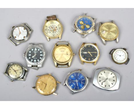 A box of gents manual and quartz wristwatches including vintage examples.