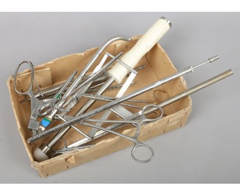 A box of assorted surgical tools.
