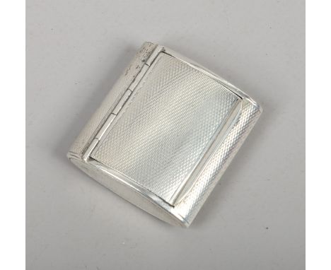 A silver snuff box with hinged cover and engine turned engraving, assayed London 1938.