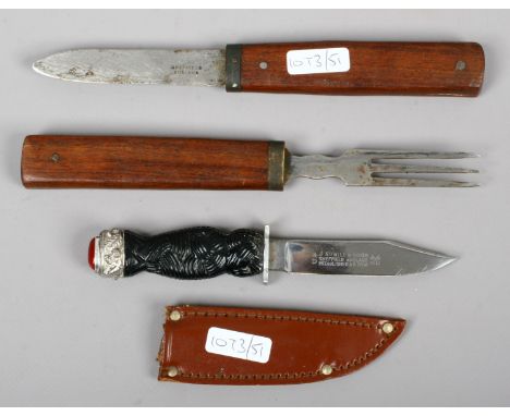 A Sheffield made travelling knife and fork set and a Scottish sgian dubh.