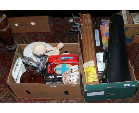 Two boxes of miscellaneous and collectables including a Winsor and Newton artists easel, cased violin, a banjo barometer, bra