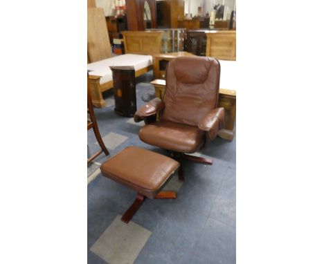 A Vintage Swivel Armchair with Matching Footrest 