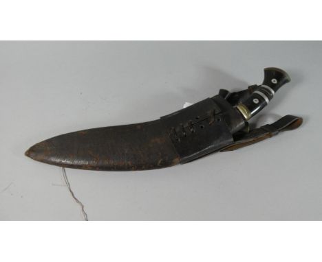 A Kukri Knife with Two Daggers in Leather Scabbard 