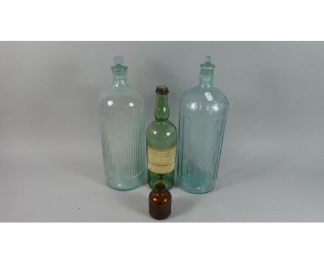 A Vintage Poison Bottle with Stopper, Similar Size Bottle, Chartreuse Bottle and Brown Glass Lysol Container 