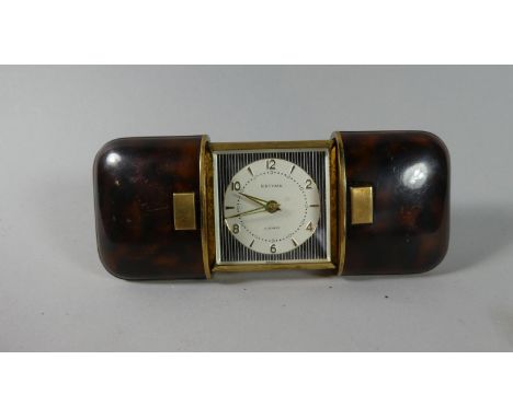 A Mid 20th Century Estyma Travel Clock in Faux Tortoiseshell Case, Having Four Jewel Movement 
