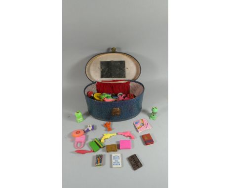 A Vintage Ladies Makeup Bag Containing Plastic Toys 