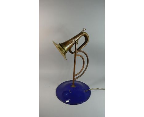 A Novelty Table Lamp Formed from a Brass Bugle Set on Copper Pipe Stand with Circular Blue Enamelled Base, 62cm High 