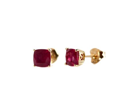 PAIR OF RUBY STUD EARRINGS, the cushion shaped rubies totalling approximately 3.00 carats, marked 9K to the posts and butterf