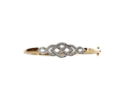 DIAMOND BANGLE, the openwork diamond set section to the front totalling approximately 0.25 carats, marked 375, 10.8g