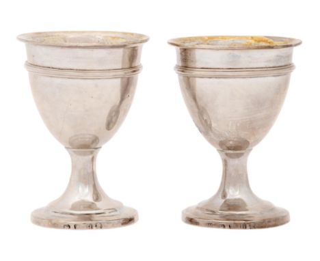 A pair of George III silver eggcups, with reeded girdle, 69mm h, maker's mark rubbed, probably William Bennett, London 1803, 