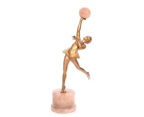 An art deco gold painted spelter figure of a female dancer, c.1930, alabaster base, 31cm h Cracked at ankle, minor chips to b