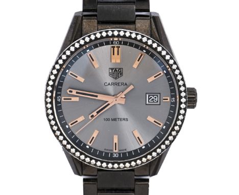A Tag Heuer diamond set titanium gentleman's wristwatch, Carrera, quartz movement, 39.5mm diam, maker's bracelet and two spar