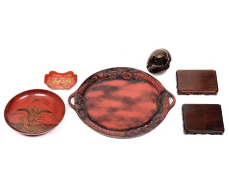 A Japanese bronze figure of daruma, 20th c, 10cm h, two Chinese huanghuali stands, and three lacquer wares (6) As a group in 