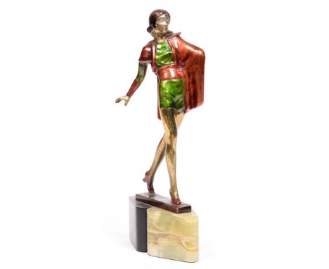 An art deco painted spelter statuette of a lady on onyx and slate base, 27cm h Tiny chips to base, otherwise good condition