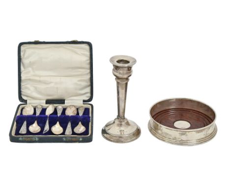 An Elizabeth II silver wine coaster, 12cm diam, by W I Broadway &amp; Co, Birmingham 1994, a silver candlestick, Birmingham 1