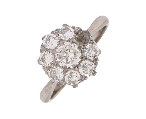 A diamond ring, with a cluster of eight round brilliant cut diamonds (originally nine), in white gold marked 18c, 3.3g, size 