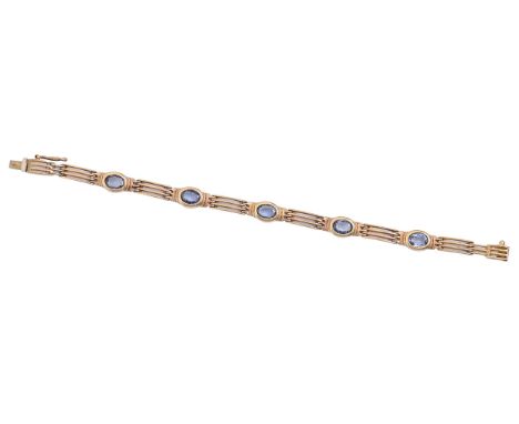 A sapphire gate bracelet,&nbsp;in gold and of thirteen links, 17.5cm l, marked 375, 14g Good condition